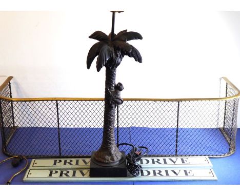 A selection to include an early 20th century brass and wirework fire fender, a novelty table lamp as a monkey climbing a palm