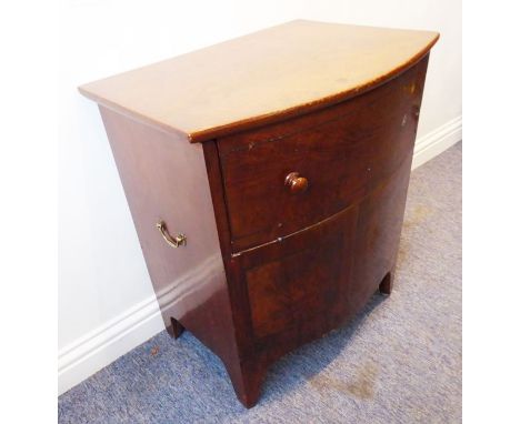 An early 19th century bow-fronted mahogany commode raised on French-style bracket feet (62cm wide)