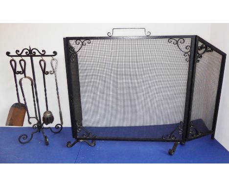 A heavy wrought-iron and wire-mesh fireguard with folding ends, together with a fireside companion set