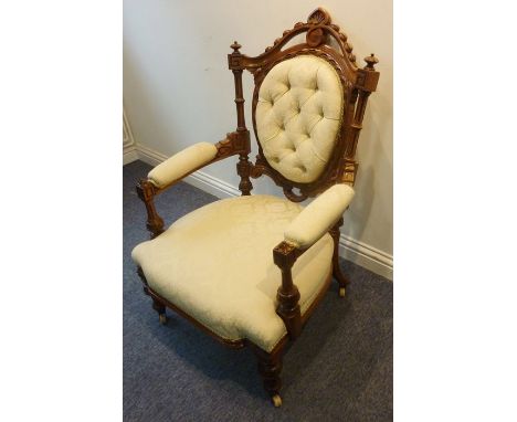 A good and unusual carved walnut and upholstered button-back open armchair from third quarter 19th century; the top rail surm