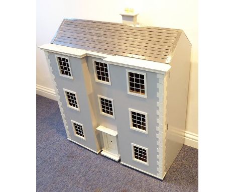 A fine and impressive 1970s scratch-built dolls' house in the Georgian style; double fronted and painted in Georgian grey and