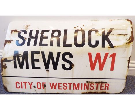 An enamel London street sign: Sherlock Mews - City of Westminster W1 (traffic damaged) (71 x 44cm)