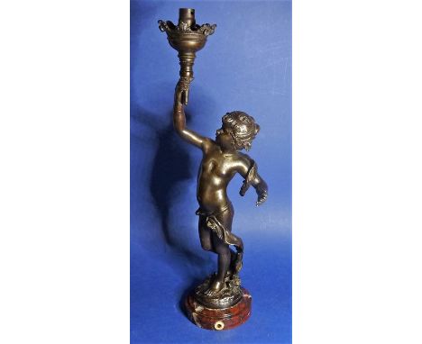 A circa 1910&nbsp;cast-metal lamp base in the form of a cherub bearing a torch (approx 39cm high and the red marble base 9.3c