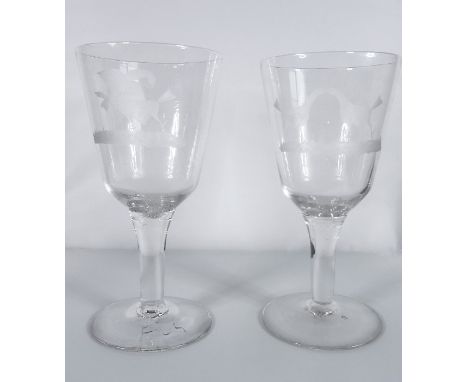 A pair of cock-fighting glasses (approx. 19.5cm high)Condition Report: Both the glasses stand around 19.25cm high. One is eng