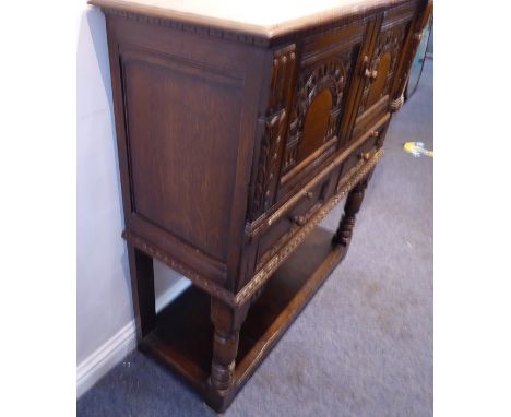 A Titchmarsh &amp; Goodwin oak wine cabinet with slidesVery good condition; deliberately aged; high quality item