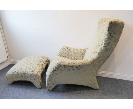 A fine upholstered modern designer armchair together with matching angular pouffe; the entire chair upholstered in pale-green