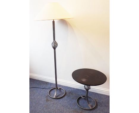 A modern designer lamp standard with a wrythen middle;&nbsp; together with a matching circular side table (2)