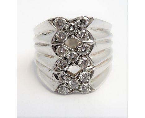 A heavy 18-carat white-gold 'triple kiss' ring set with 15 fine white diamonds (The cost of UK postage via Royal Mail Special