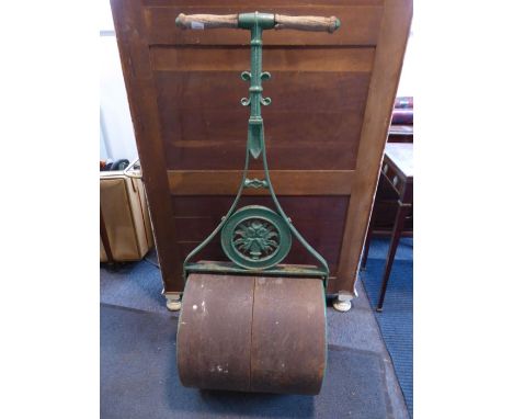 An early 20th century garden roller;&nbsp;green-painted cast-iron and turned wooden handles