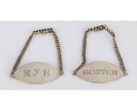 Pair of Chinese export silver decanter labels, the oval labels engraved RYE and SCOTCH, on chains with clasps, 0.4oz