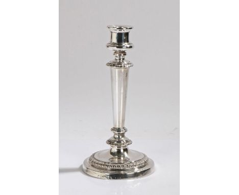 George IV silver candlestick, London 1821, maker Matthew Boulton, the baluster sconce above a gadrooned and tapering stem, ra