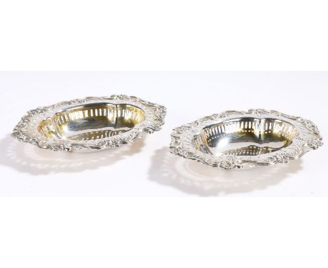 Pair of Edward VII silver bonbon dishes, London 1901/02, maker William Hutton &amp; Sons Ltd. with pierced foliate cast borde