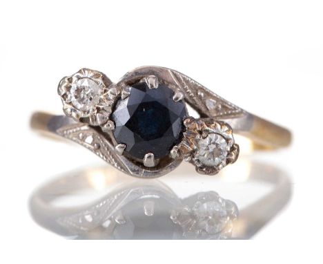 SAPPHIRE AND DIAMOND THREE STONE RING,set with a round sapphire flanked by two diamonds totalling approximately 0.10 carats, 