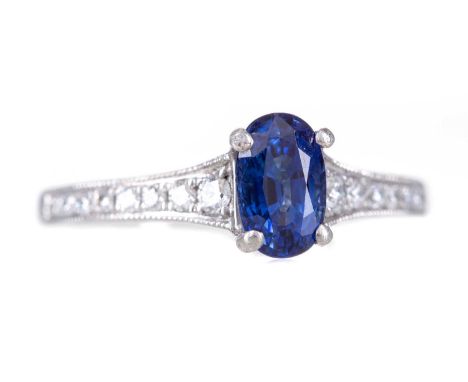 SAPPHIRE AND DIAMOND RING,set with an oval sapphire of approximately 1.27 carats, on diamond shoulders totalling approximatel