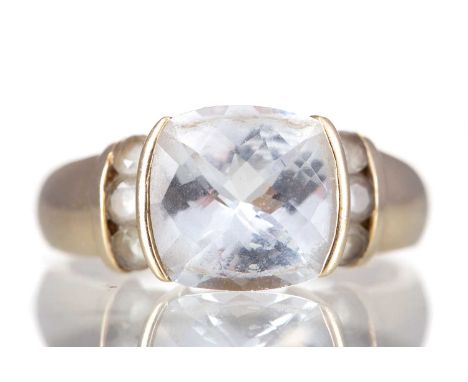 QUARTZ RING,set with a cushion shaped quarts flanked by round quartz on the shoulders, marked 14K, size O 1/2, 5g