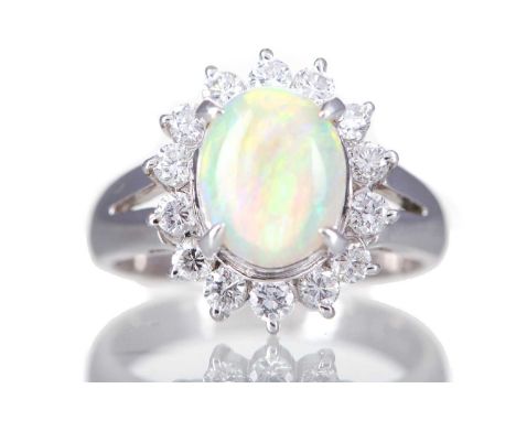 OPAL AND DIAMOND RING,set with an oval cabochon opal of approximately 1.05 carats, within a diamond halo of approximately 0.4