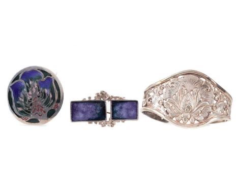 TWO SILVER NORMAN GRANT BROOCHES,each with blue/purple enamel, along with an unmarked cuff of openwork design (3)