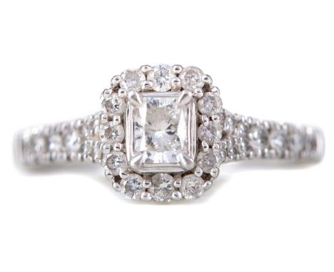 DIAMOND DRESS RING,set with central square radiant cut diamond within a round brilliant cut diamond halo, on diamond shoulder