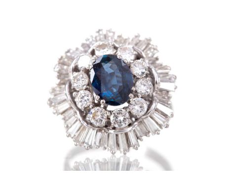 SAPPHIRE AND DIAMOND BALLERINA RING,set with a central oval sapphire of approximately 3.00 carats, within a round brilliant c