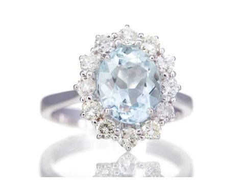 AQUAMARINE AND DIAMOND RING,set with n oval aquamarine of approximately 2.50 carats, within a round brilliant cut diamond hal