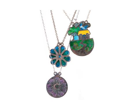 THREE SILVER NORMAN GRANT ENAMELLED PENDANTS,two depicting flowers and the other a landscape scene, each signed to the revers