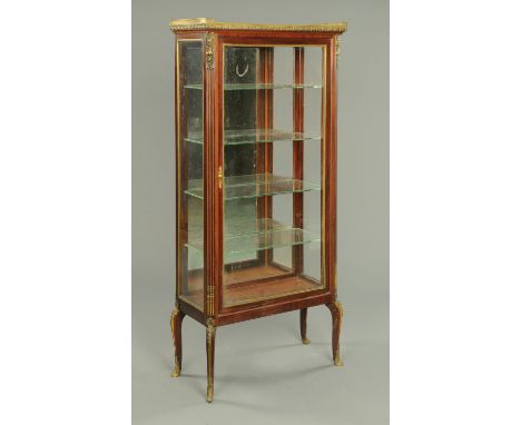 An Edwardian mahogany display cabinet, in the French style, with marble top with three quarter gallery, heavy glass panels an