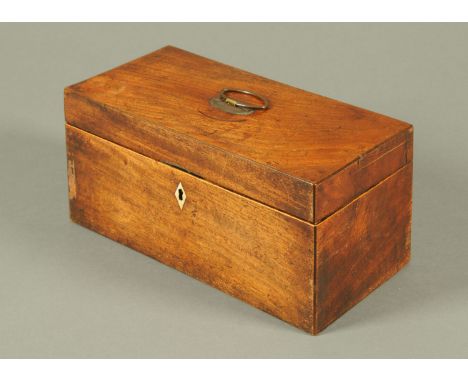 A George III mahogany tea caddy, rectangular, with centre aperture and two lidded compartments.  Width 30 cm. 
