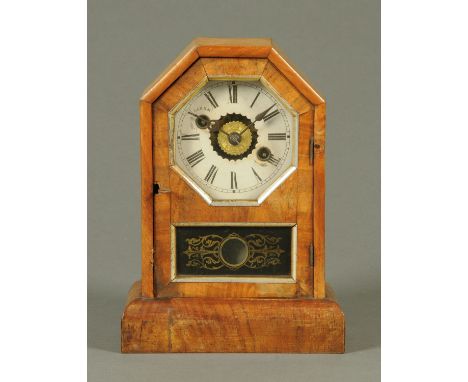 A Victorian walnut American alarm mantle clock, two-train striking movement.  Height 25 cm. 