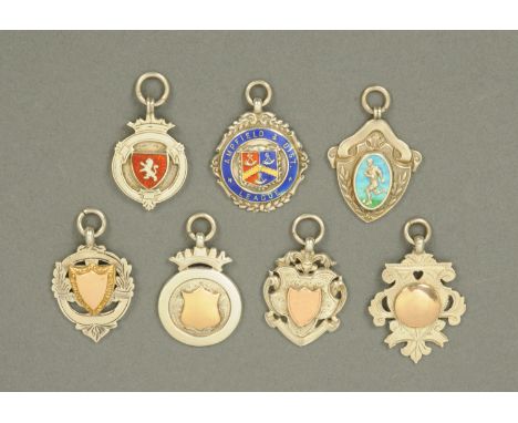 An Edwardian silver and enamel football medal, Birmingham 1908, and six others, including Ampfield & District League, Birming