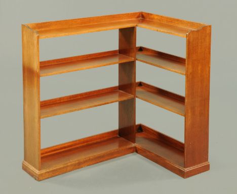 A mahogany corner shelf unit, four tier.  Longest length 87 cm, return 65 cm, height 87 cm. 