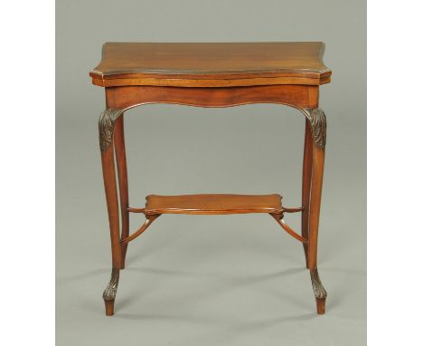 An Edwardian mahogany turnover top card table. with serpentine edge, foliate carved cabriole legs and low shaped shelf.  Widt