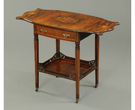 An Edwardian rosewood twin drop flap side table, of butterfly wing design, with single frieze drawer, low shelf and raised on