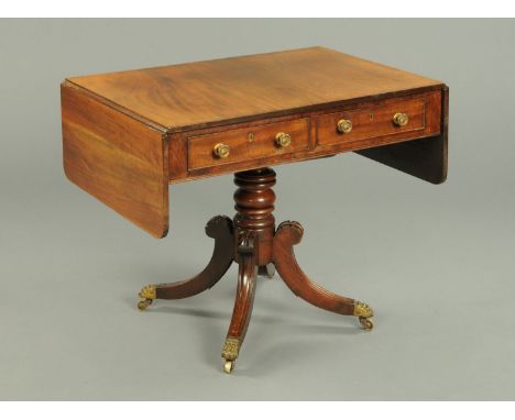 A Regency mahogany sofa table, fitted with two frieze drawers and raised on a turned centre column with four downswept legs t