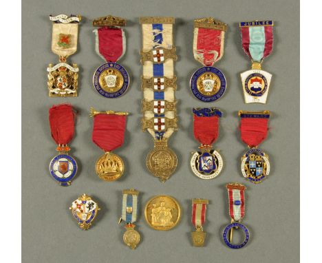 A collection of fourteen Masonic silver and enamel medallions.