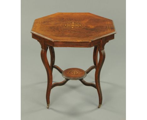 An Edwardian rosewood octagonal centre table, with boxwood stringing and raised on shaped legs united by a circular shelf and