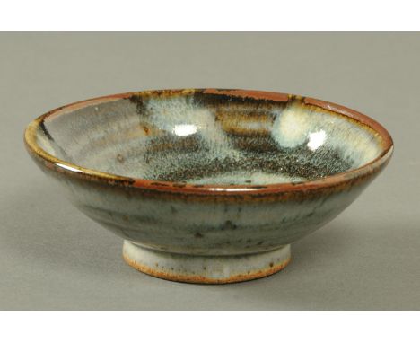 Edward Hughes (1953-2006), a small shallow bowl, light green and brown glaze, purchased 2004.  Diameter 12.5 cm. 