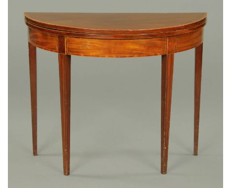 A George III mahogany rosewood banded demi-lune card tale, with green baize lined playing surface and raised on legs of squar