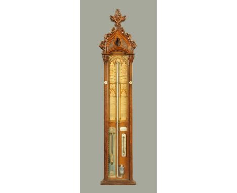 A Victorian Admiral Fitzroy's barometer, in oak case with Gothic carved pediment, paper label and adjustable vernier scales a