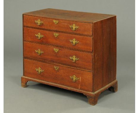 A George III oak chest of drawers, with caddy top above four long graduated drawers with brass drop handles with pierced back