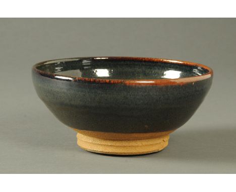 William Staite Murray (1881-1962), a large bowl, with unglazed base, impressed artist's monogram, Chun glaze.  Originally pur