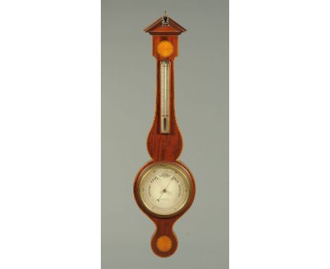 An Edwardian inlaid mahogany cased aneroid barometer, by The Stereoscopic Company, Regent Street.  Height 100 cm. 