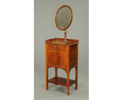 An Edwardian inlaid mahogany shaving stand, the oval mirror with adjustable brass column support to the galleried top, with d