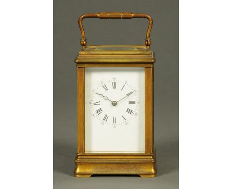 An Edwardian brass carriage clock, timepiece only, Roman numerals.  Height excluding carrying handle 15 cm.   CONDITION REPOR