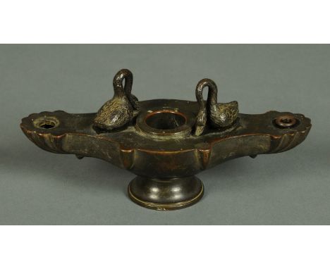 A 19th century Grand Tour inkwell, in the form of an oil lamp with swan mounts.  Length 17 cm. 