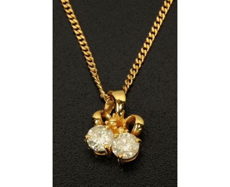 An 18 ct gold pendant, set with two diamonds and with chain. 