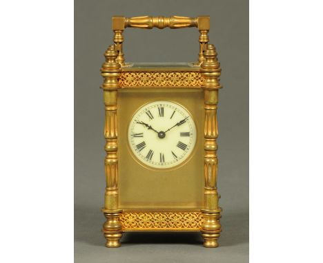 An Edwardian brass carriage clock, with circular enamelled dial with Roman numerals, timepiece only, 1086 grams.  Height 12 c