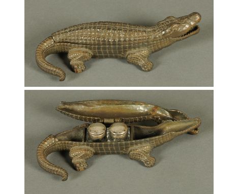A Victorian cast iron crocodile inkwell, by Linton.  Length 25 cm. 