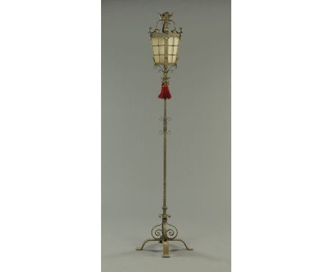 A wrought iron lamp standard, with lantern type top.  Height 194 cm. 