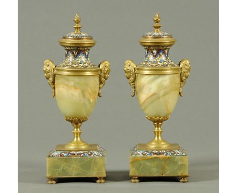 A pair of late 19th century Champleve enamel urns, with onyx bodies and bases.  Height 32 cm. 