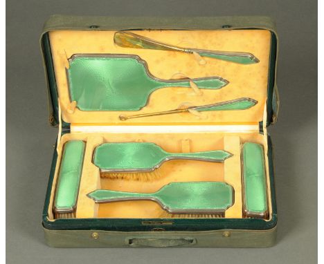 A Harrods cased silver and enamel dressing table set, London 1934.